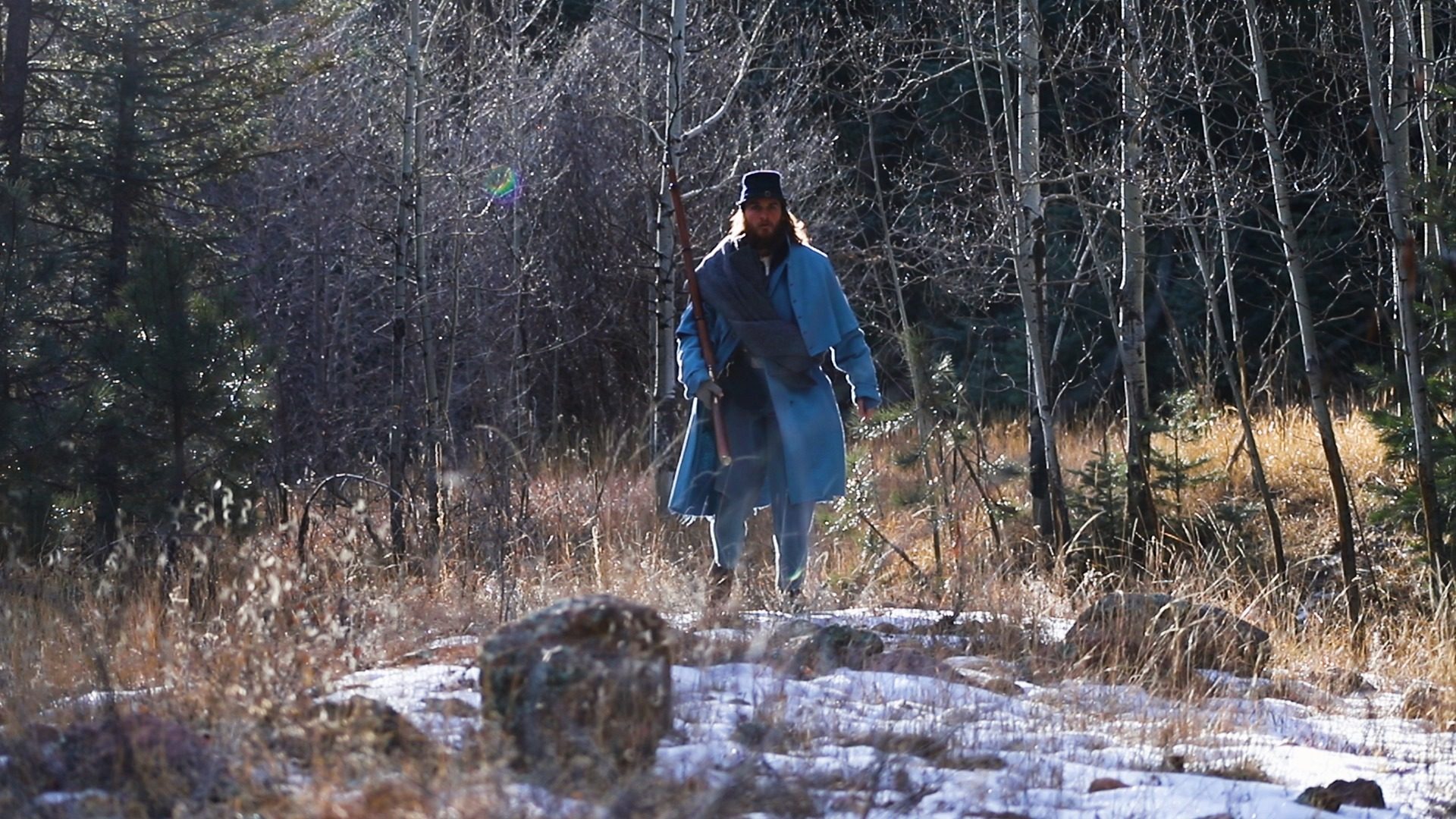 Soldier in a snowy aspen grove