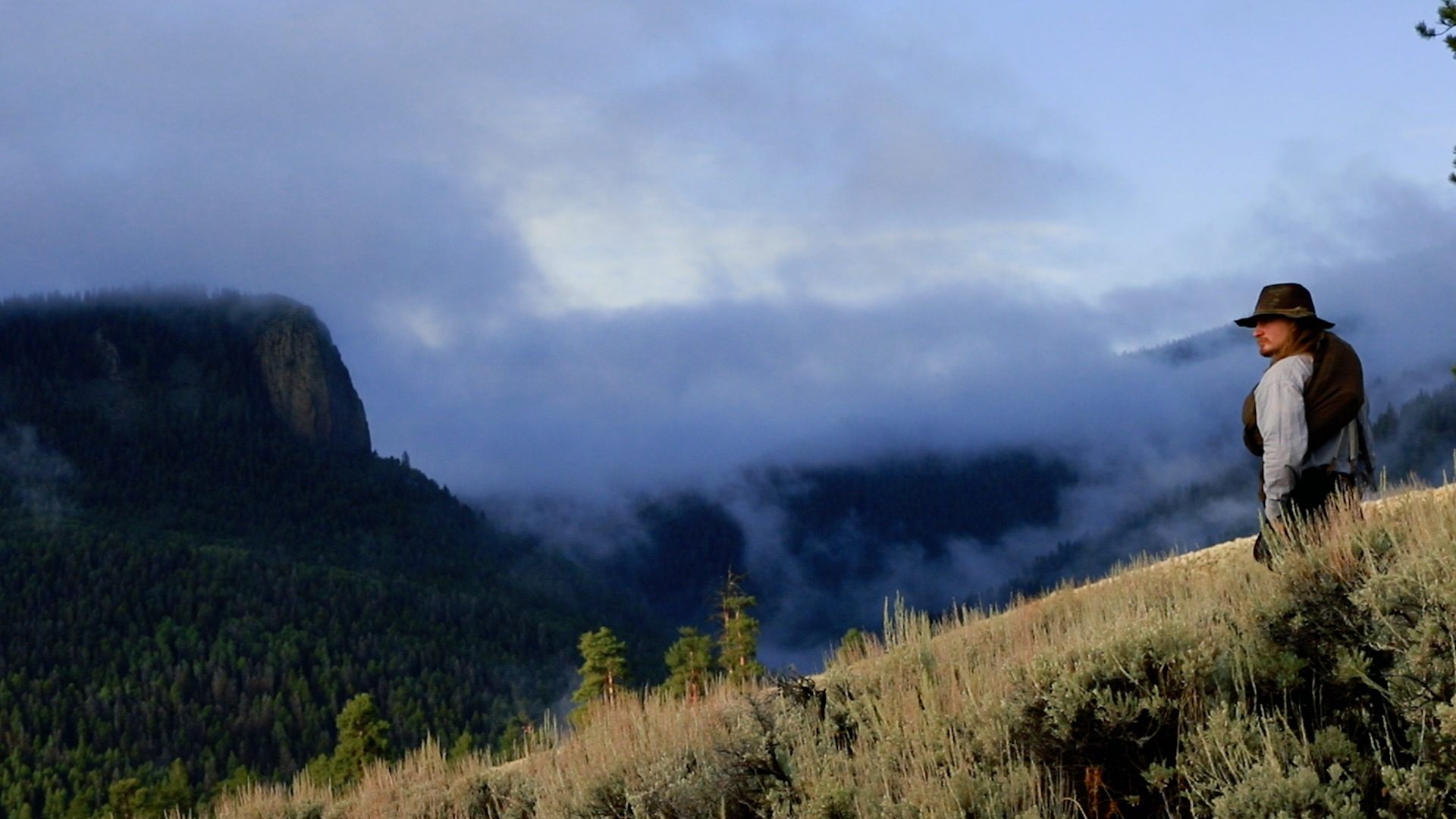 Soldier overlooking a misty valley